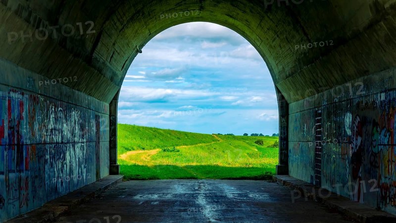 Tunnel and a view of the meadows. The tunnel under the 'Knybawa Bridge' over the Vistula River. Tczew