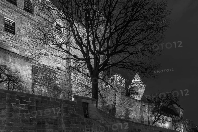 Illuminated Sinwell Tower with Kaiserburg Castle in the Evening