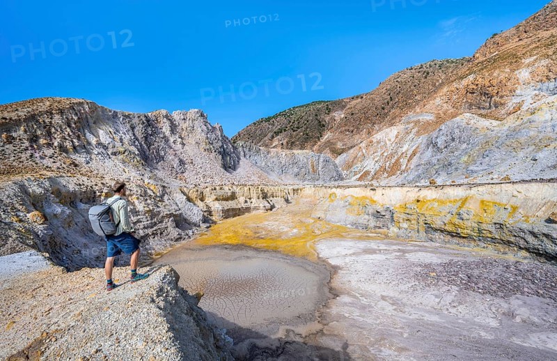 Young man at the crater rim