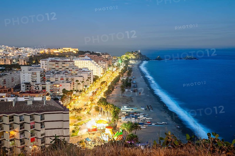 Panorama of touristic illuminated coast in Almunecar at night