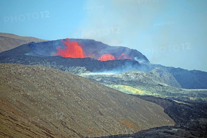Sulphur fields and lava fields in front of volcanic craters