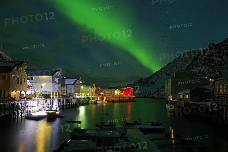 Northern lights (aurora borealis) over small harbour