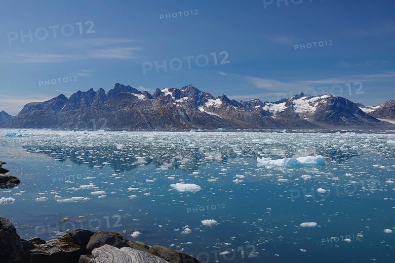View of a fjord filled with drift ice