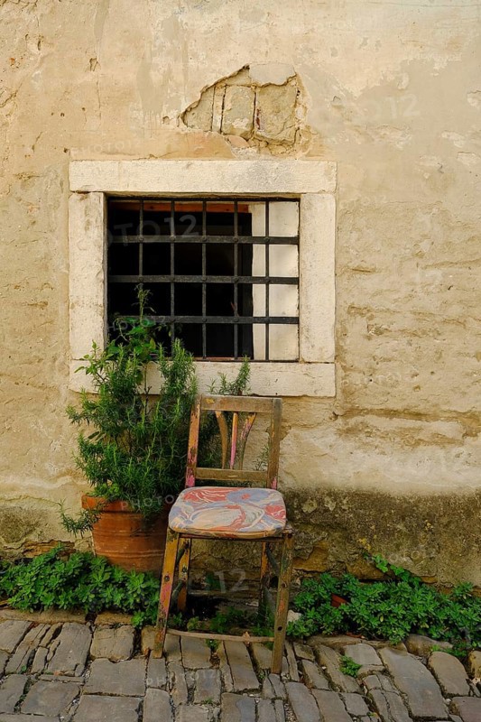 Old armchair in front of window