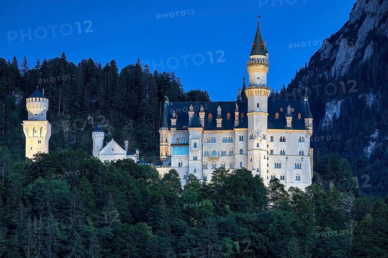 Illuminated Neuschwanstein Castle in the last evening light
