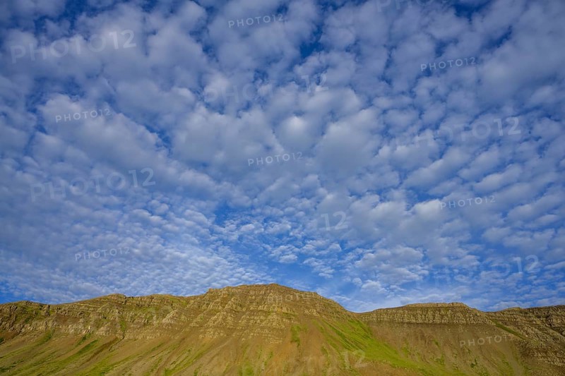 Sheep clouds and mountains in the evening light