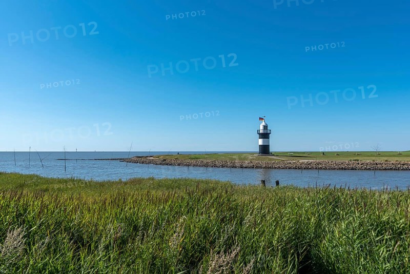 Coastal landscape with the Kleiner Preusse lighthouse in the background