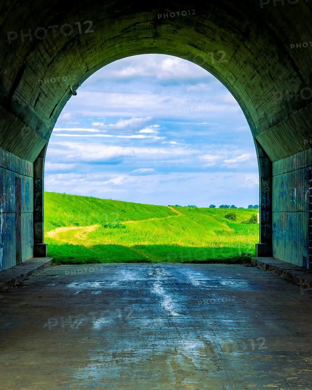 Tunnel and a view of the meadows. The tunnel under the 'Knybawa Bridge' over the Vistula River. Tczew