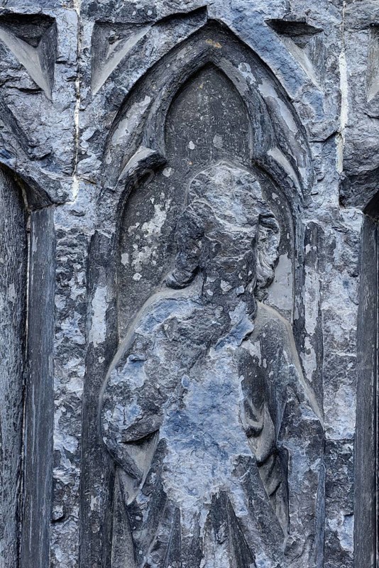 Old sculptures in need of renovation at the entrance gate to Notre-Dame Cathedral in Tournai