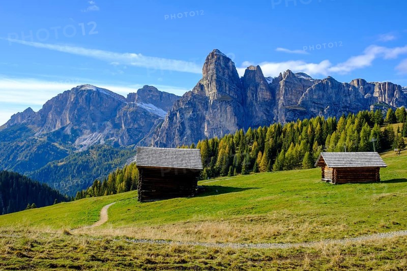 Mountain huts and sassongher from the Pralongia plateau