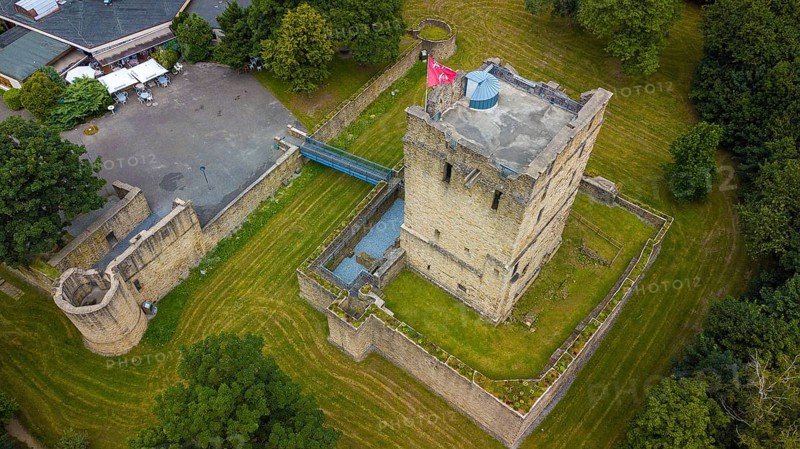Fortified castle tower of ruin of partly reconstructed former moated castle Burg Altendorf from the Middle Ages
