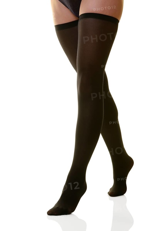 Womans legs in black stockings