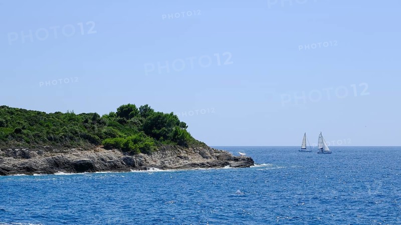 Sailboats in the sea on the coast