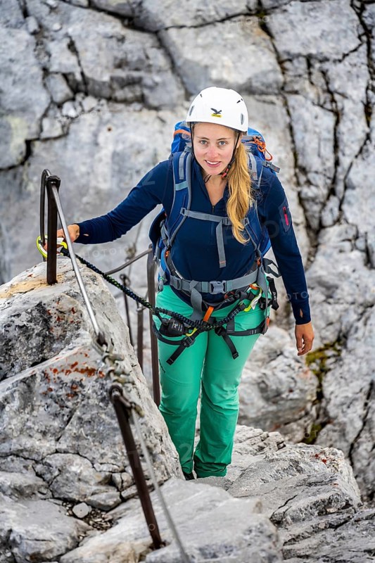 Hiker with helmet on the via ferrata to the Watzmann middle peak