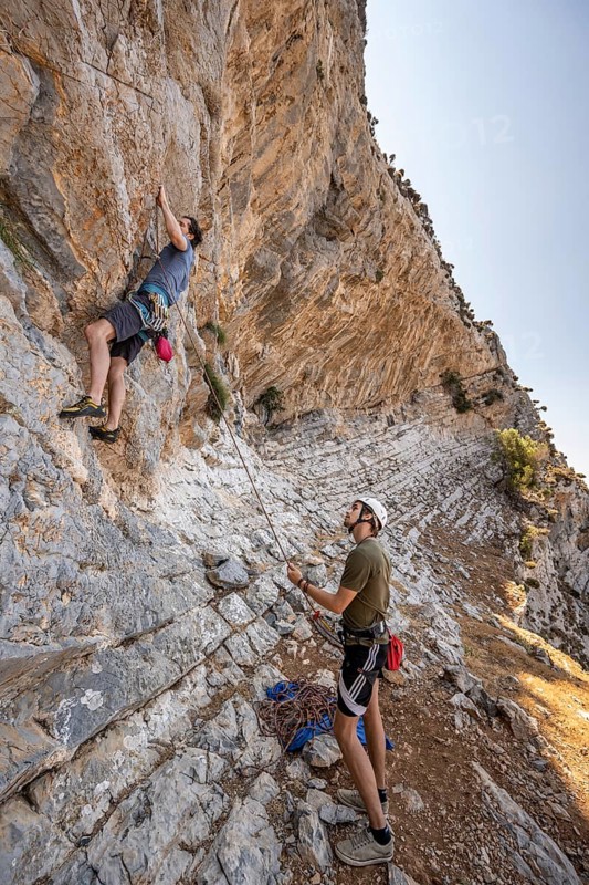 Climbing a rock face