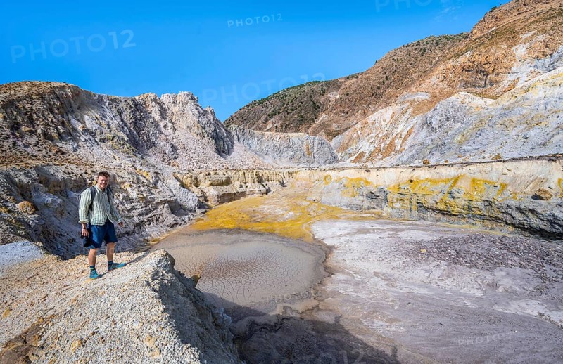 Young man at the crater rim