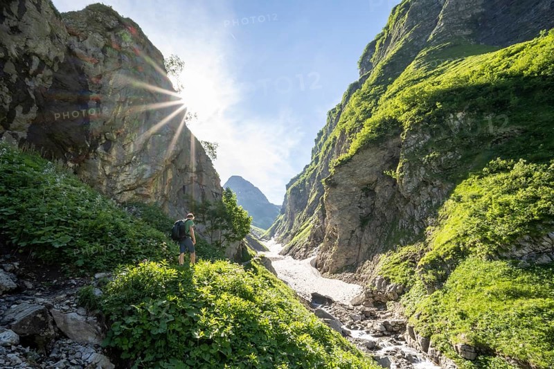 Hikers by a stream
