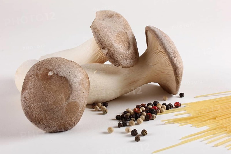 King trumpet mushrooms (Pleurotus eryngii) and peppercorns
