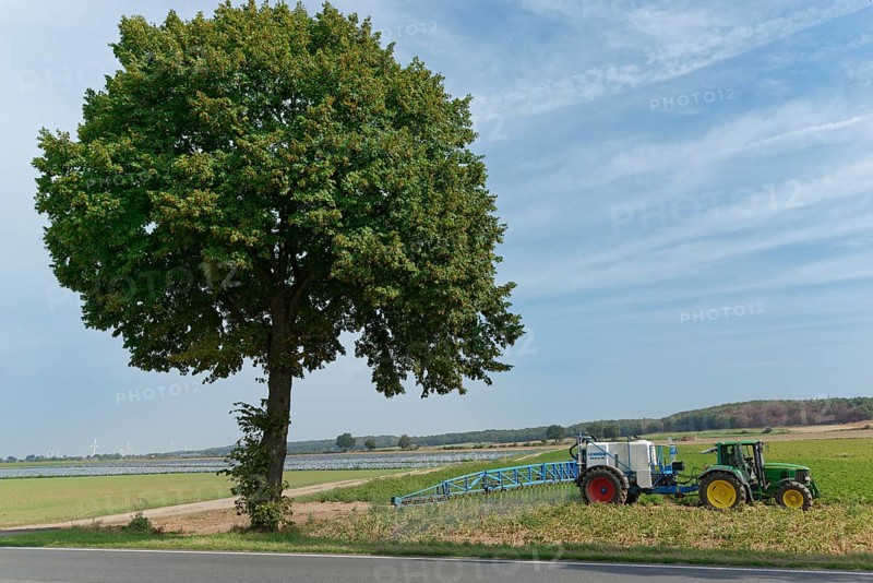 Farmer spraying pesticides