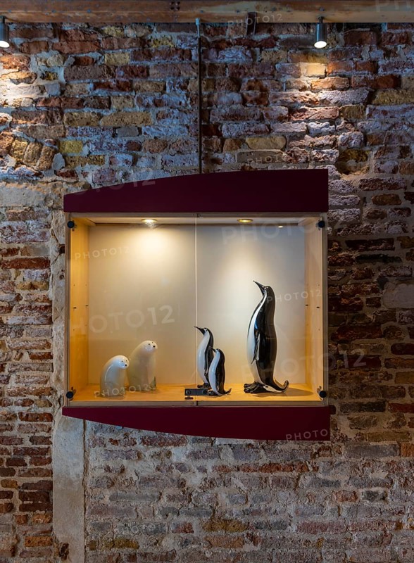 Display case with mouth-blown animal statues