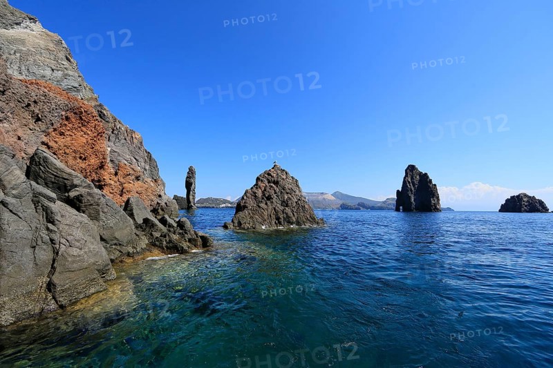 Rocks jutting out of the sea Faraglioni di Lipari at the southern tip of Lipari