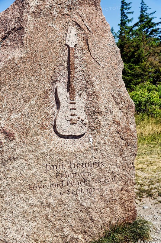 Memorial stone with inscription and relief of an electric guitar by Jimi Hendrix
