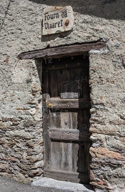 Old door with Occitan inscription
