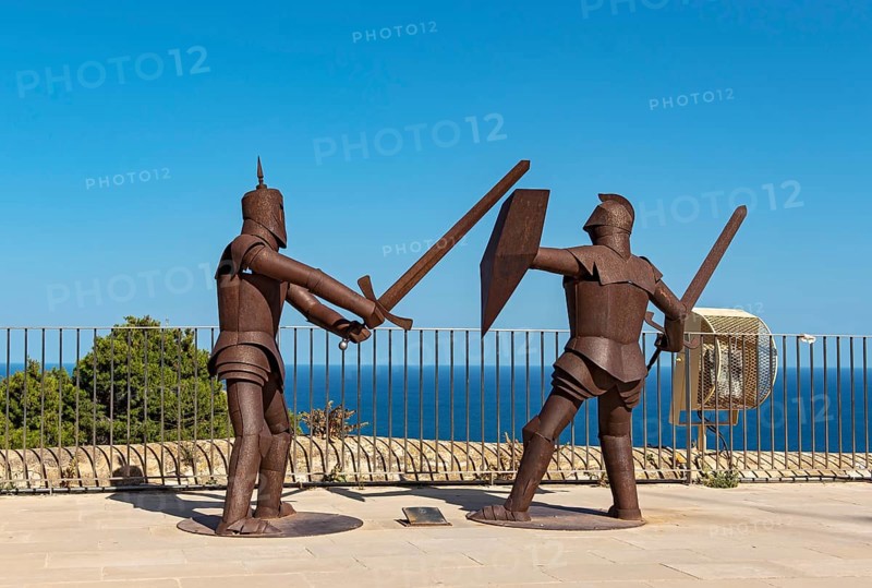 Metal statues of knights in armor