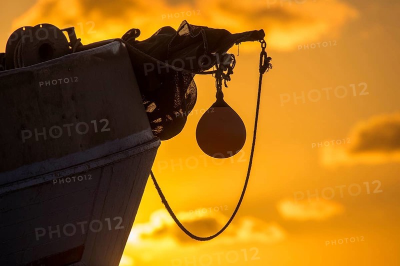 Fishing boat in sunset