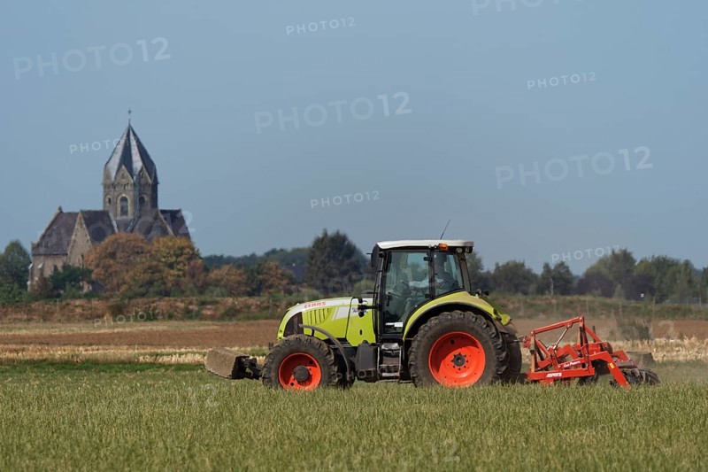 Farmer is cultivating field