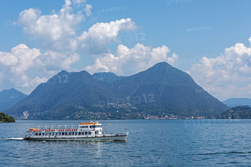 Excursion boat in front of Monte Sasso del Ferro