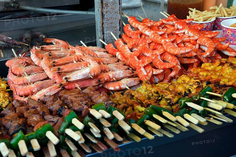 Various skewers with meat and seafood