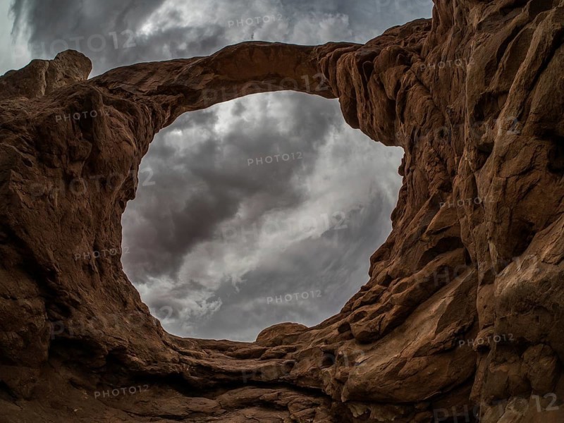 Thunderclouds over rock formations of the Windows Selection
