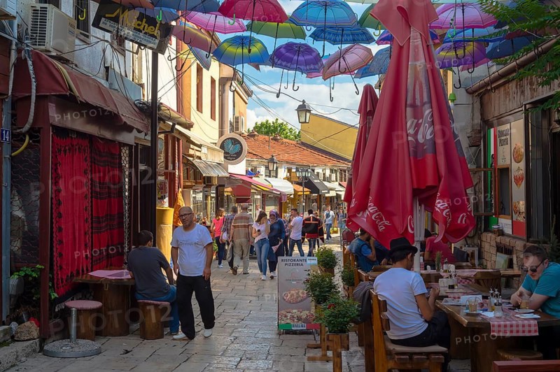 Colorful umbrellas hanging in a street
