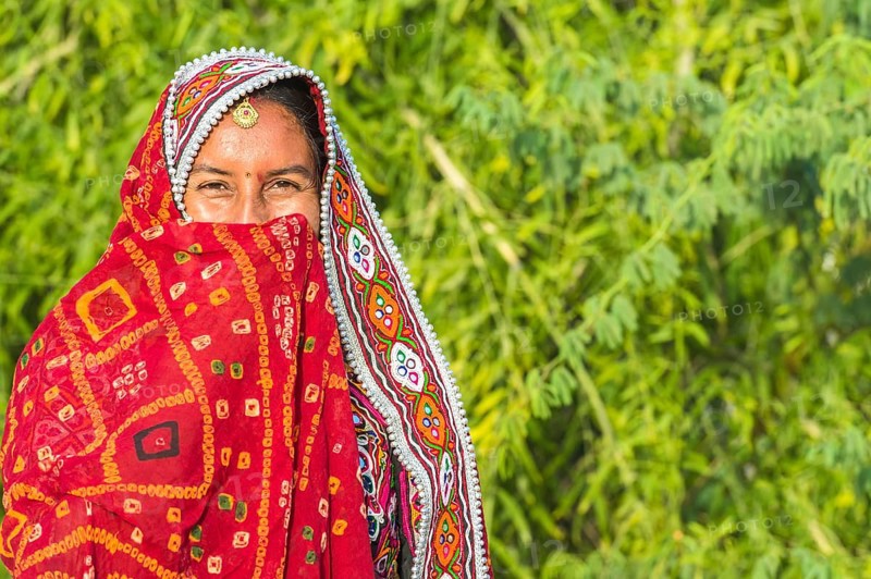 Veiled Ahir woman in traditional colourful cloth