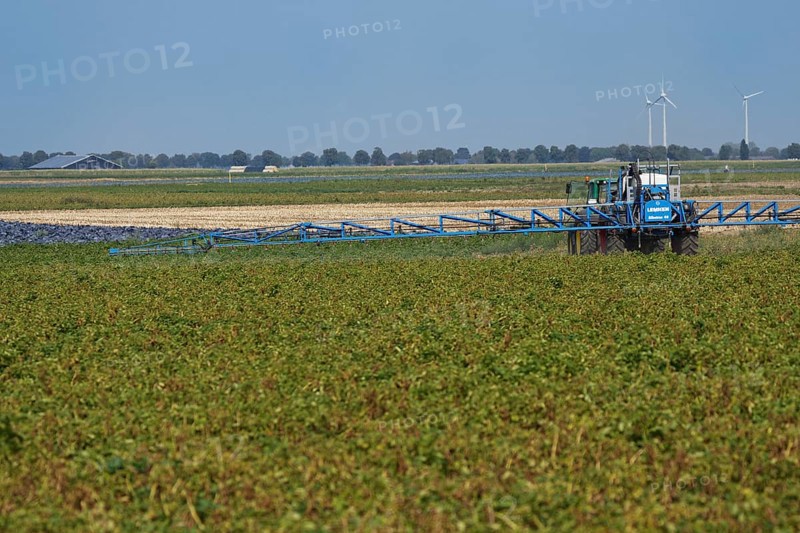 Farmer spraying pesticides