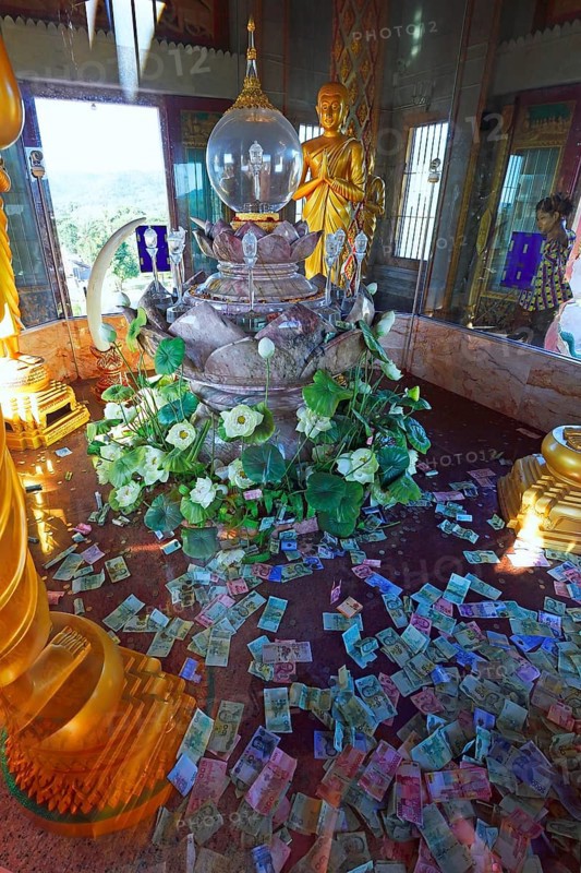 The holy of holies with banknotes as donations