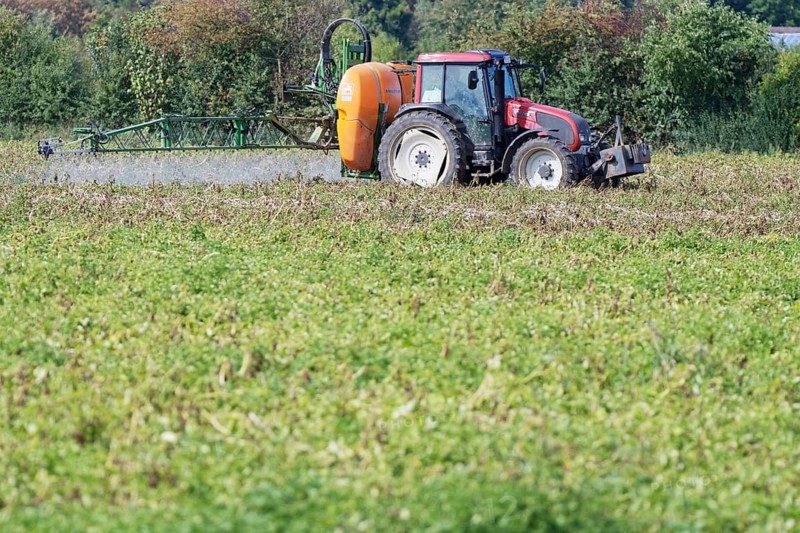 Farmer spraying pesticides