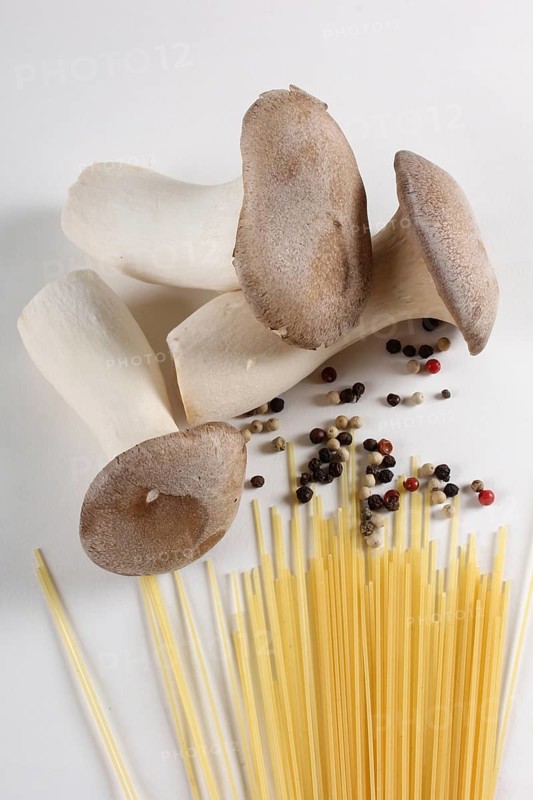 King trumpet mushrooms (Pleurotus eryngii) and peppercorns