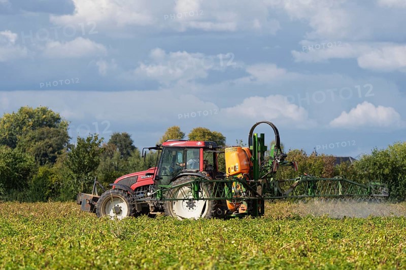 Farmer spraying pesticides