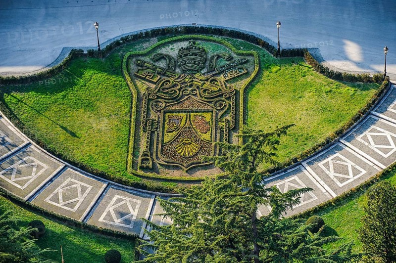 Papal coat of arms of Pope Benedict XVI in the form of flowerbed next to St. Peter's Basilica