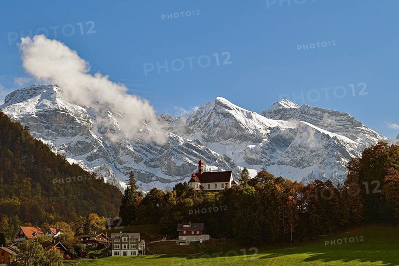 Flueeli Ranft Chapel in front of Alpine panorama