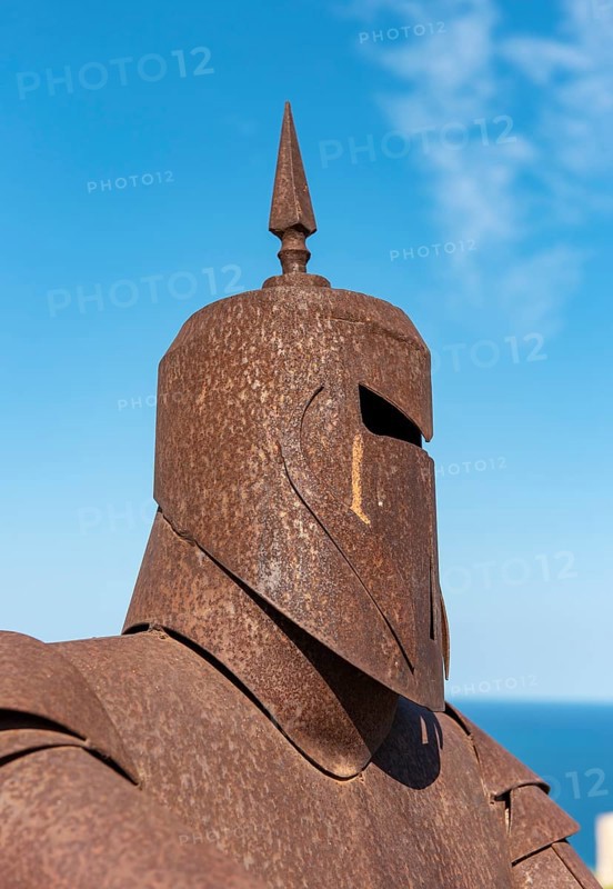Metal statue of knight in armor