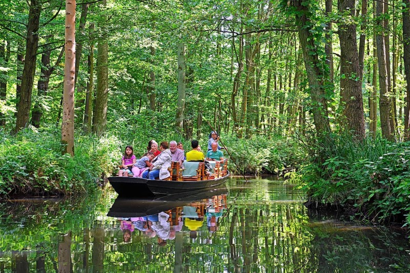 Tourists in typical barges along the Spree