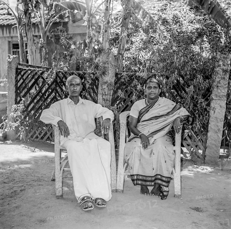 South Asian Indian old man in lungi and women in silk saree