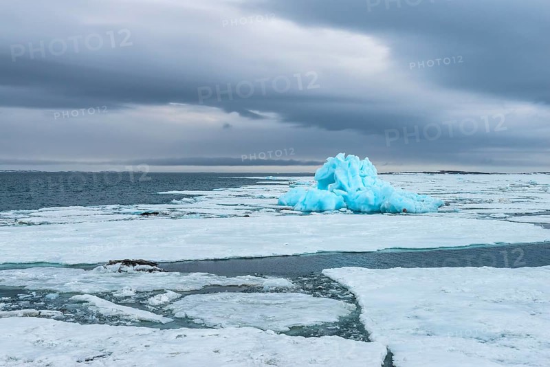 Blue iceberg drifting in Hinlopen Strait