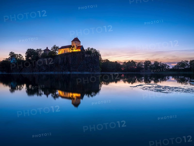 Kirchberg with mountain church and water tower at dusk