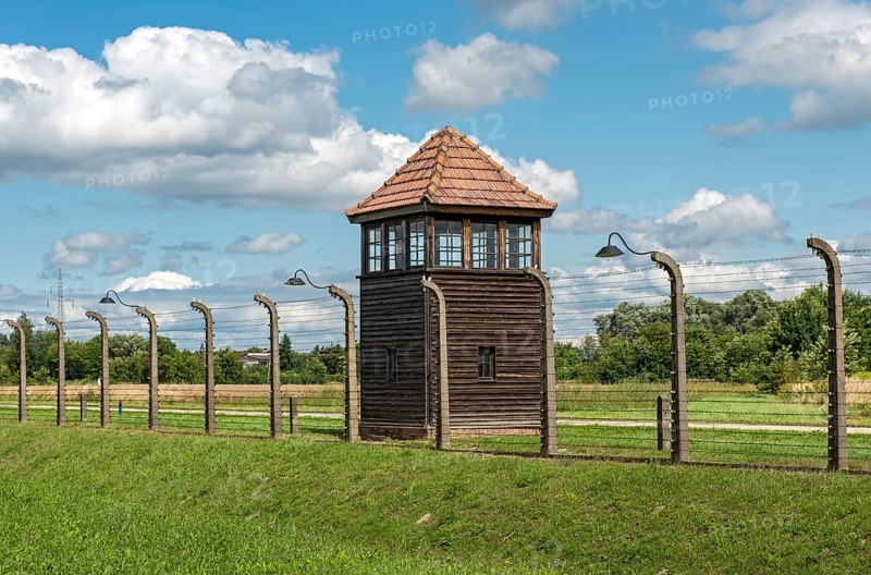 Barbed-wire fence and guard tower at Auschwitz II-Birkenau concentration camp
