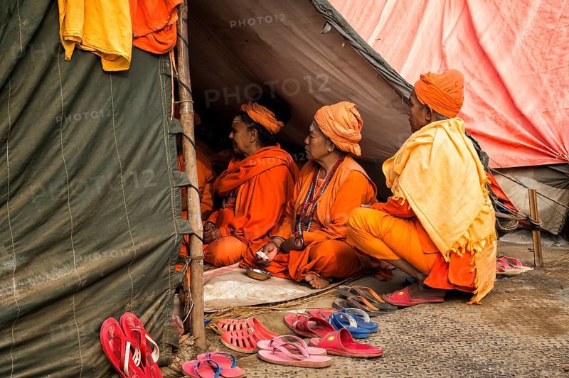 Sadhvi in orange and red saree during Allahabad Kumbh Mela