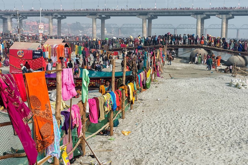 Pilgrims cross the Ganges on a makeshift pontoon bridge
